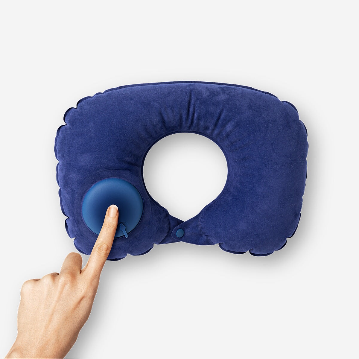 Inflatable travel pillow from Flying Tiger Copenhagen in a drawstring bag, designed for comfortable leisure travel.