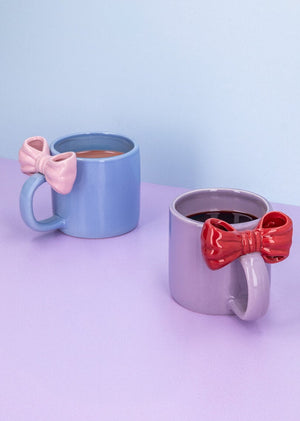 Purple 300 ml ceramic mug with embossed bow design, from Flying Tiger Copenhagen, ideal for kitchen use.