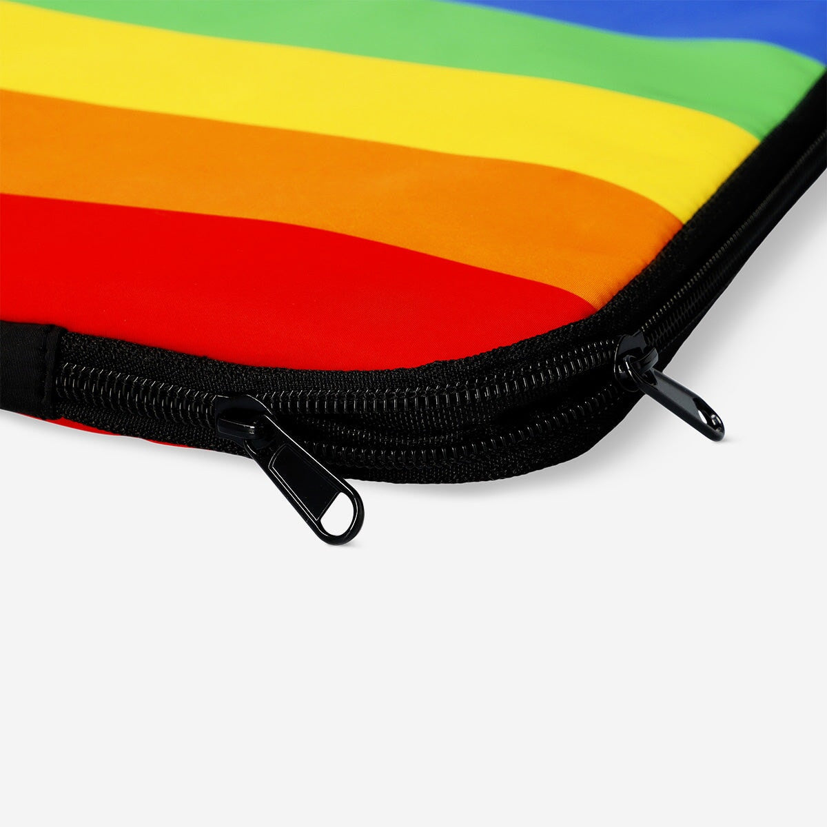 Rainbow 15-inch laptop sleeve by Flying Tiger Copenhagen, media case with colorful rainbow design and soft protective material.