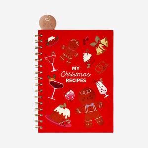 A5 Christmas recipe book by Flying Tiger Copenhagen featuring festive holiday recipes on a white office desk.