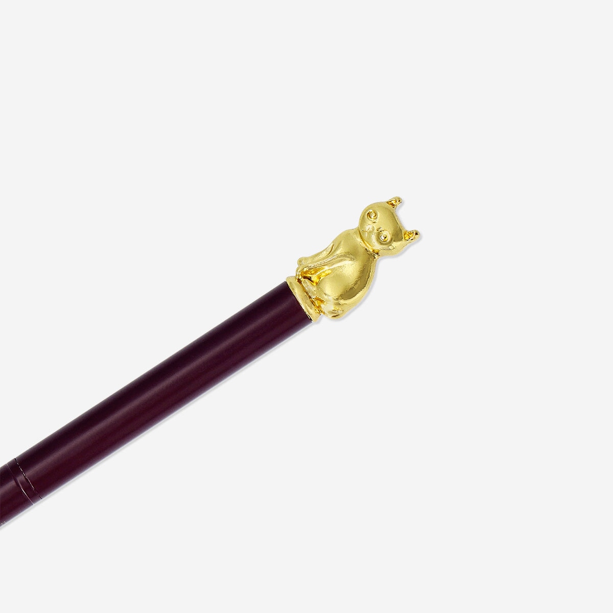 Black ink ballpoint pen with gold cat topper from Flying Tiger Copenhagen, designed for office use.