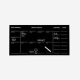 Black self-adhesive foil for office use from Flying Tiger Copenhagen, shown applied to a surface in a clean, modern workspace.