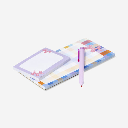 Checkered notepad with pen and memos