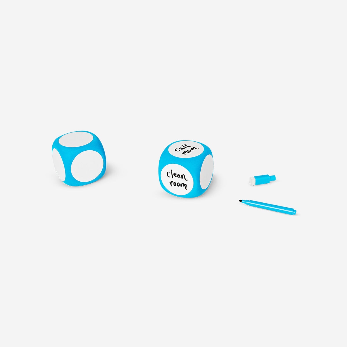 Office dice with erasable pen from Flying Tiger Copenhagen, featuring colorful numbered sides and a black erasable marker.