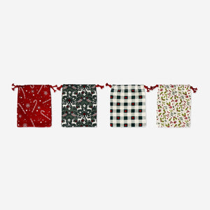 Set of four Flying Tiger Copenhagen drawstring gift bags with festive Christmas print designs for office or holiday gifting.