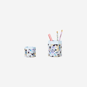 Two floral office pencil holders by Flying Tiger Copenhagen, decorative containers for organizing pens and stationery.