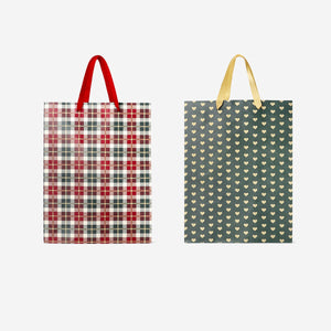 Two Flying Tiger Copenhagen office gift bags with festive Christmas patterns, perfect for holiday wrapping.