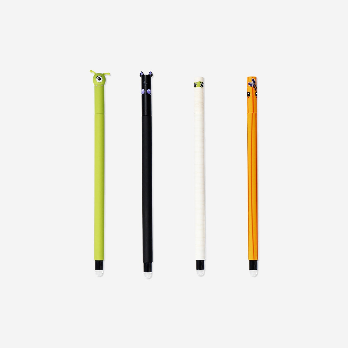 Set of 4 glow-in-the-dark erasable pens with little monster designs by Flying Tiger Copenhagen for office use.