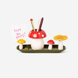 Flying Tiger Copenhagen mushroom-shaped office pencil holder on a desk, designed for organizing pens and stationery.