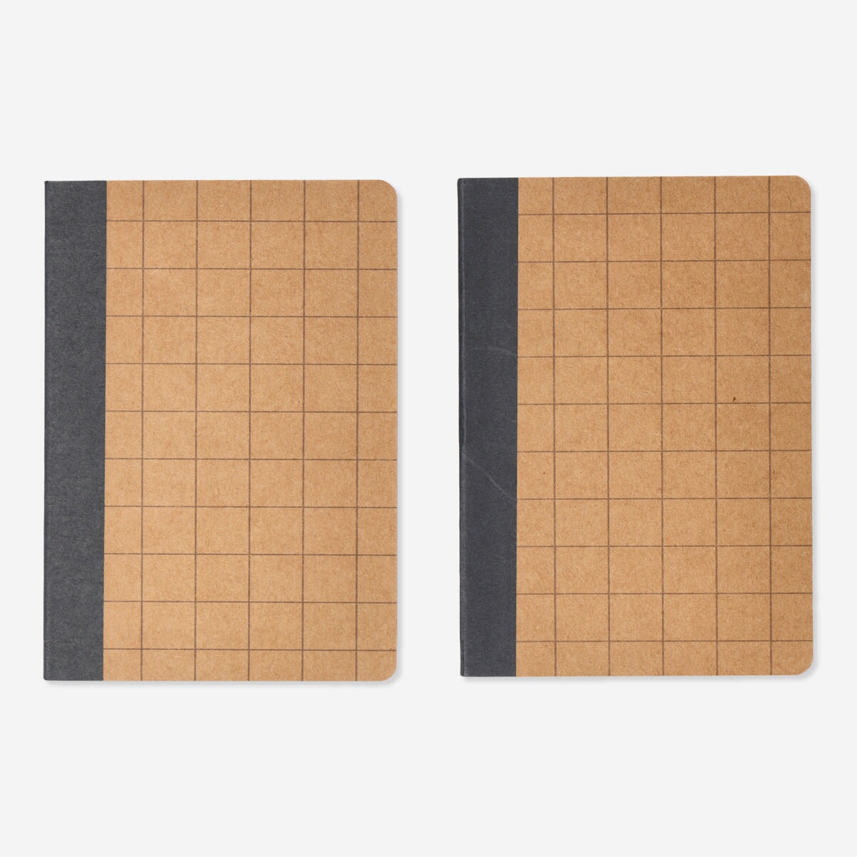 Set of two Flying Tiger Copenhagen office notebooks with plain covers, ideal for note-taking and organization.
