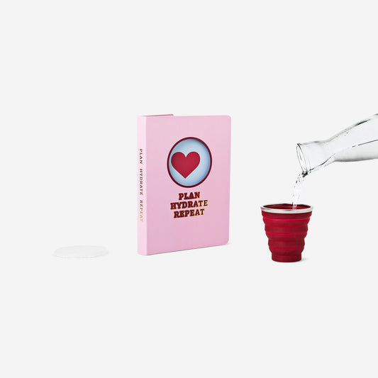 Libreta rosa con taza