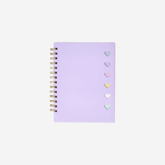 Libreta morada con bolígrafo y notas adhesivas