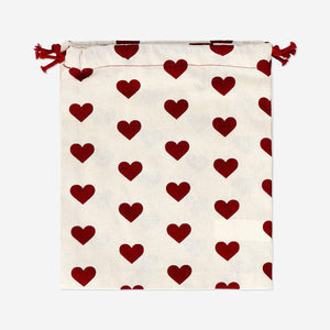 Two reusable cotton gift bags with heart patterns from Flying Tiger Copenhagen, ideal for office gifting and eco-friendly wrapping.