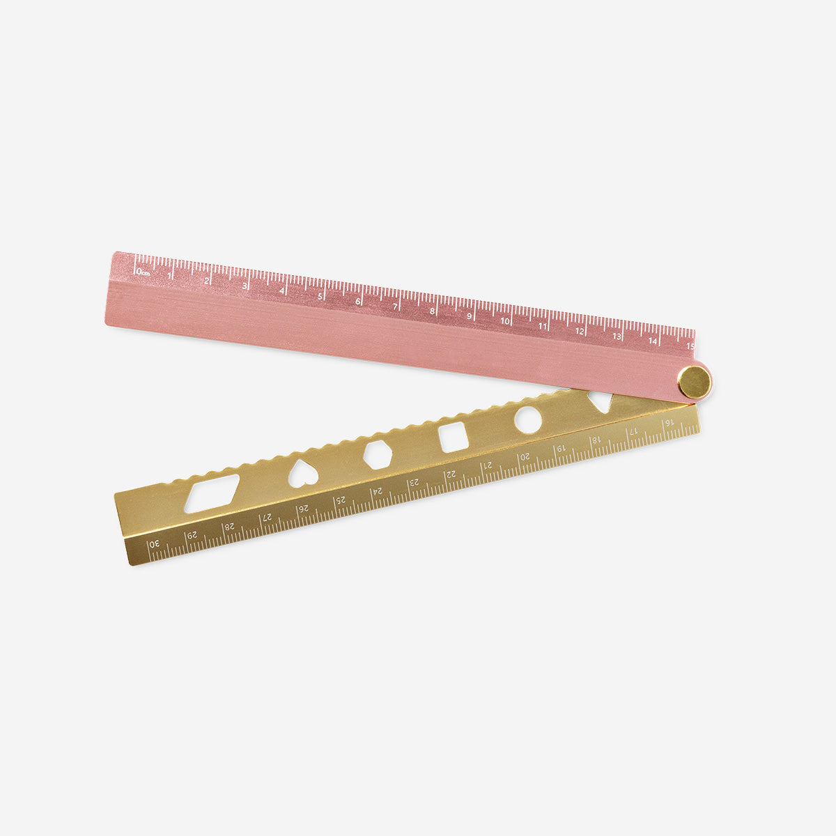 Rose foldable metal ruler for office use by Flying Tiger Copenhagen, showing a compact, pink metal ruler in a folded position.