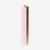 Rose foldable metal ruler for office use by Flying Tiger Copenhagen, showing the compact, pink, foldable design on a white background.