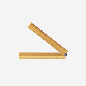 Foldable office ruler from Flying Tiger Copenhagen, showing a compact, foldable design with measurement markings visible.