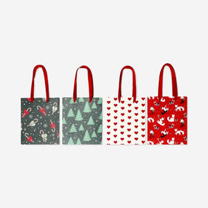 Set of four Flying Tiger Copenhagen office gift bags with festive Christmas patterns, perfect for holiday gift wrapping.
