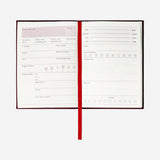 Flying Tiger Copenhagen wine tasting journal with linen cover for office use, featuring space to record wine notes and tasting details.