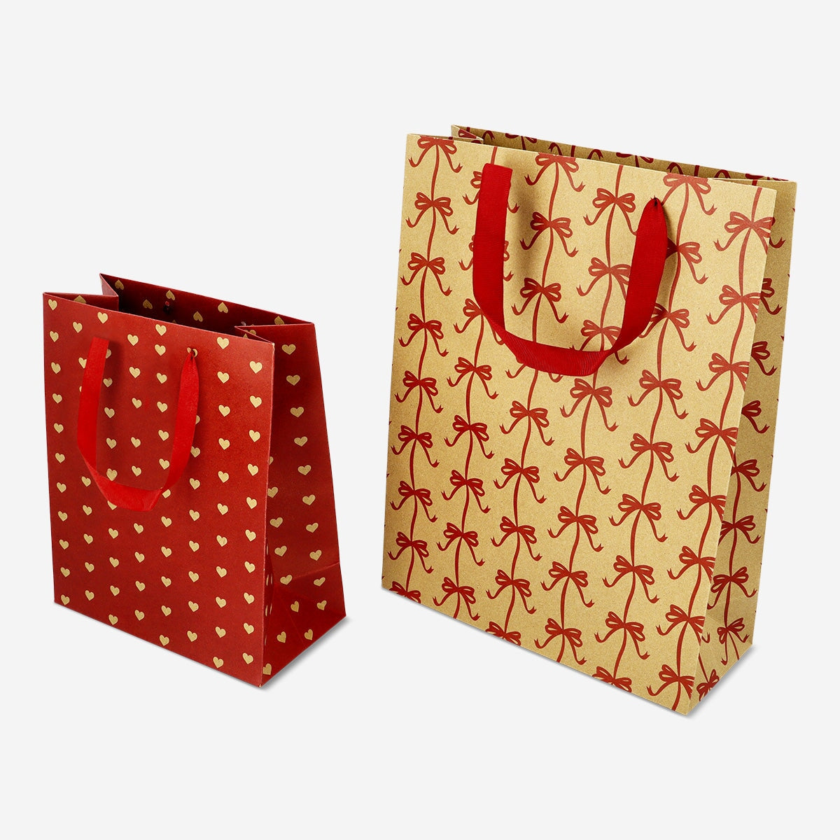 Two festive Christmas gift bags from Flying Tiger Copenhagen, perfect for party presents with holiday-themed designs.