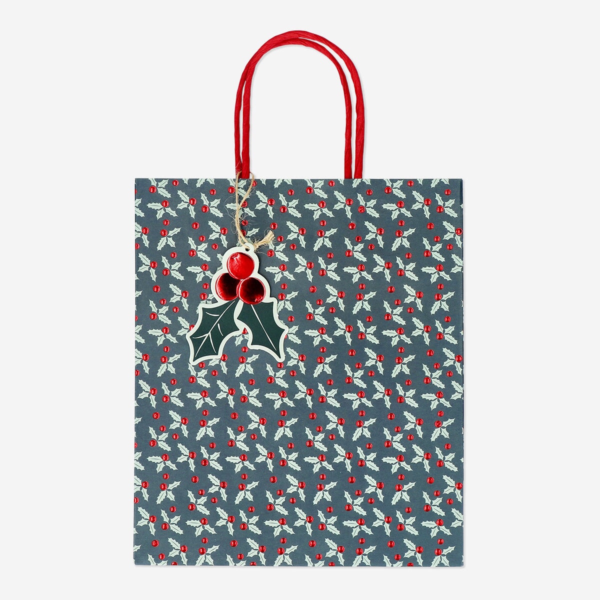 Party gift bag with debossed holly pattern from Flying Tiger Copenhagen, featuring festive holiday leaf designs.