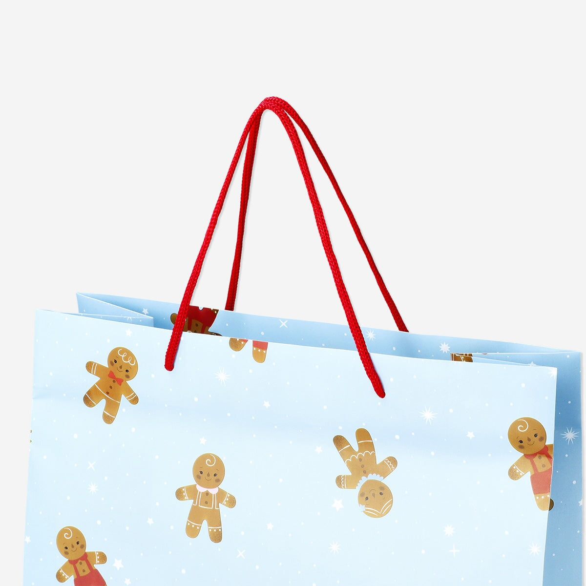Party gift bag with gingerbread people design from Flying Tiger Copenhagen, featuring festive holiday-themed illustrations.