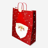 Party gift bag with Santa's face, featuring festive red and white colors, from Flying Tiger Copenhagen.