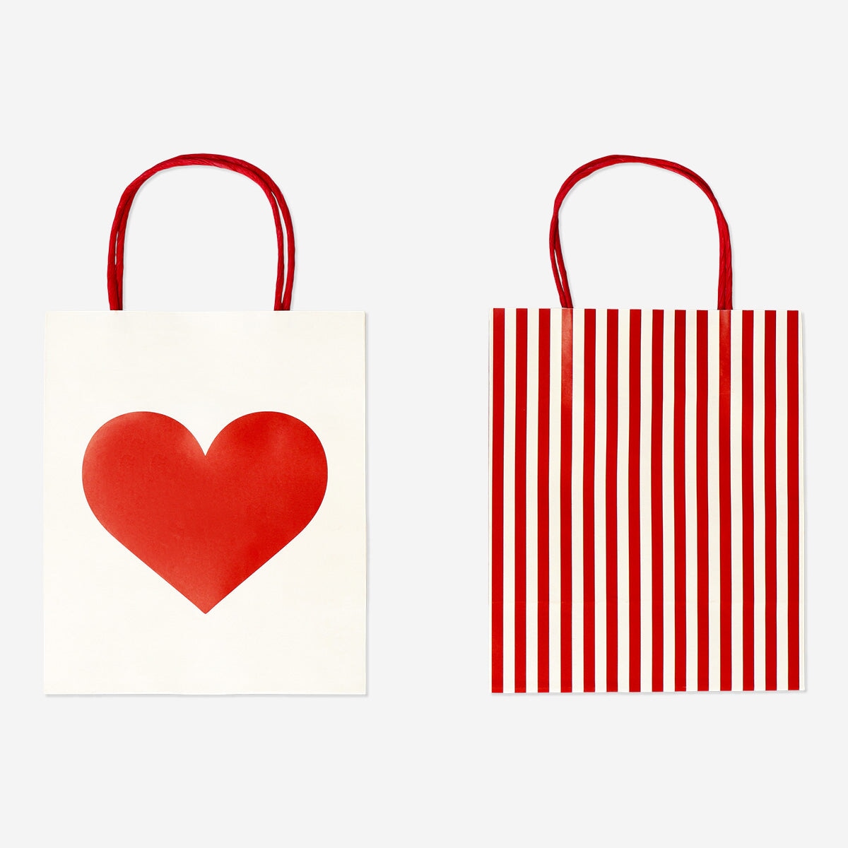 Pair of Flying Tiger Copenhagen party gift bags with heart designs, perfect for celebrations and gift wrapping.