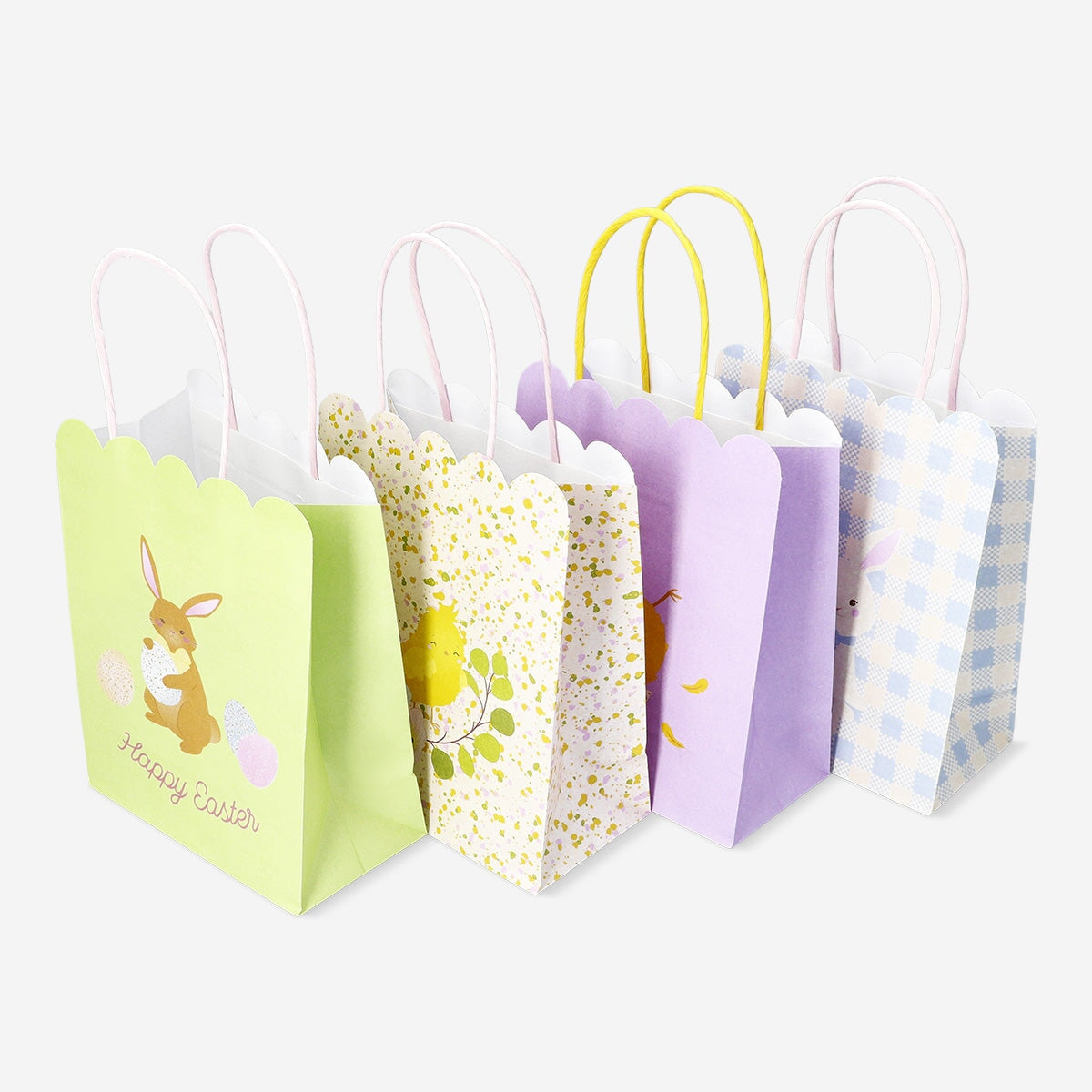 Set of four Flying Tiger Copenhagen party gift bags with scalloped edges, perfect for festive gift wrapping.