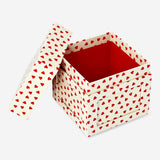 Party gift box for photos with red hearts from Flying Tiger Copenhagen, featuring decorative red heart accents for celebrations.