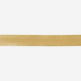 Gold satin ribbon for parties, 10 meters long, by Flying Tiger Copenhagen, shown draped and rolled for gift wrapping and decoration.