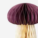 Two honeycomb mushroom table decorations for party decor by Flying Tiger Copenhagen, featuring colorful, foldable paper mushrooms.