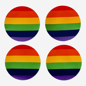 Set of four colorful plastic plates for parties by Flying Tiger Copenhagen, perfect for serving snacks and desserts.