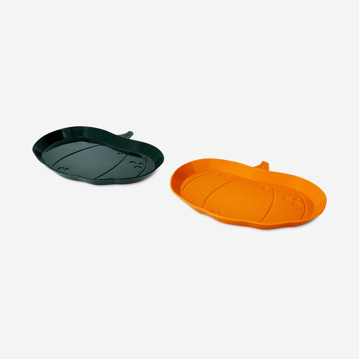 Two reusable pumpkin-shaped party plates from Flying Tiger Copenhagen, ideal for festive gatherings and seasonal celebrations.