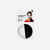 Black and white face paint by Flying Tiger Copenhagen, ideal for personal care and costume makeup, shown on a palette with brushes.