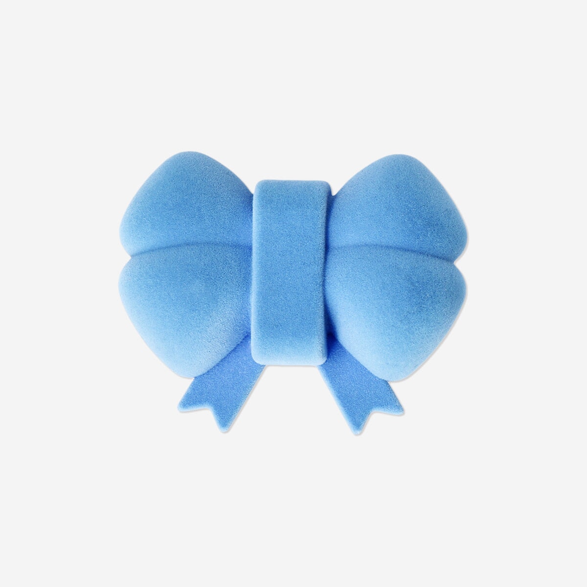Blue bow-shaped jewellery storage box by Flying Tiger Copenhagen, ideal for organizing rings and necklaces.