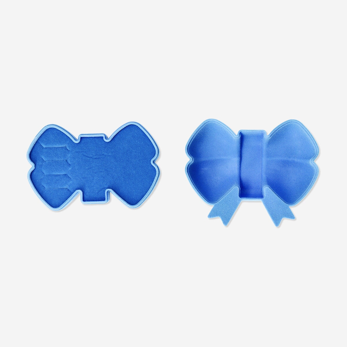 Blue bow jewelry storage box by Flying Tiger Copenhagen, designed for organizing necklaces, rings, and small accessories.