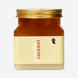 Flying Tiger Copenhagen vanilla caramel body scrub in a 500g jar, highlighting its creamy texture and luxurious fragrance.