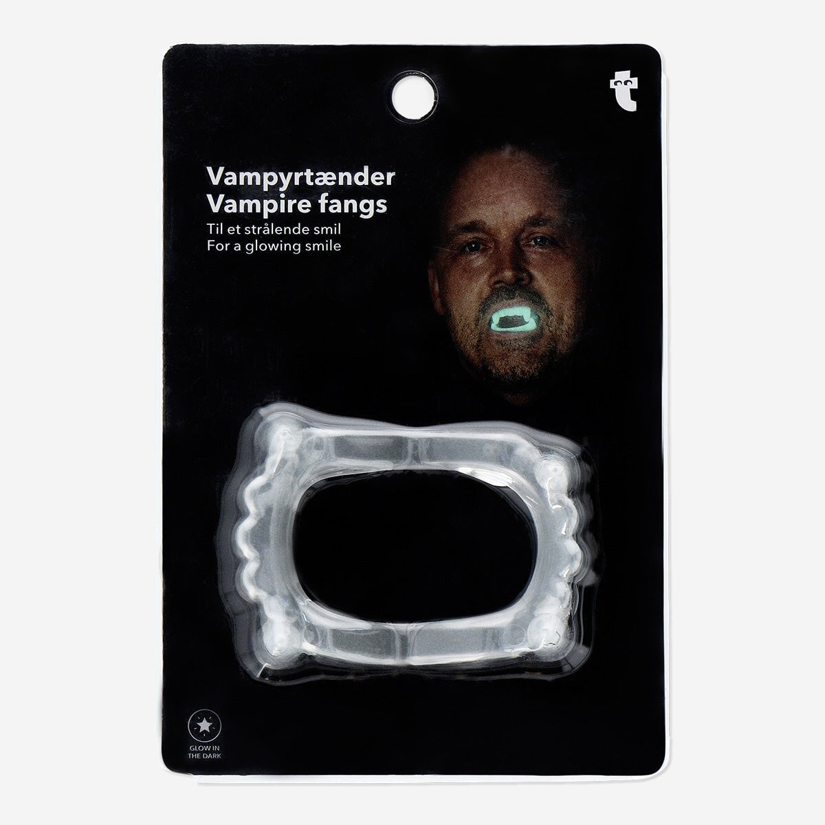 Glow in the dark vampire fangs from Flying Tiger Copenhagen, one size, showing realistic plastic vampire tooth set for costume use.