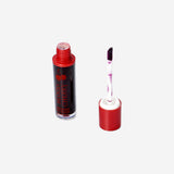 Flying Tiger Copenhagen cherry-flavored lip gloss with blood-red tint, featuring a shiny, moisturizing personal care product.