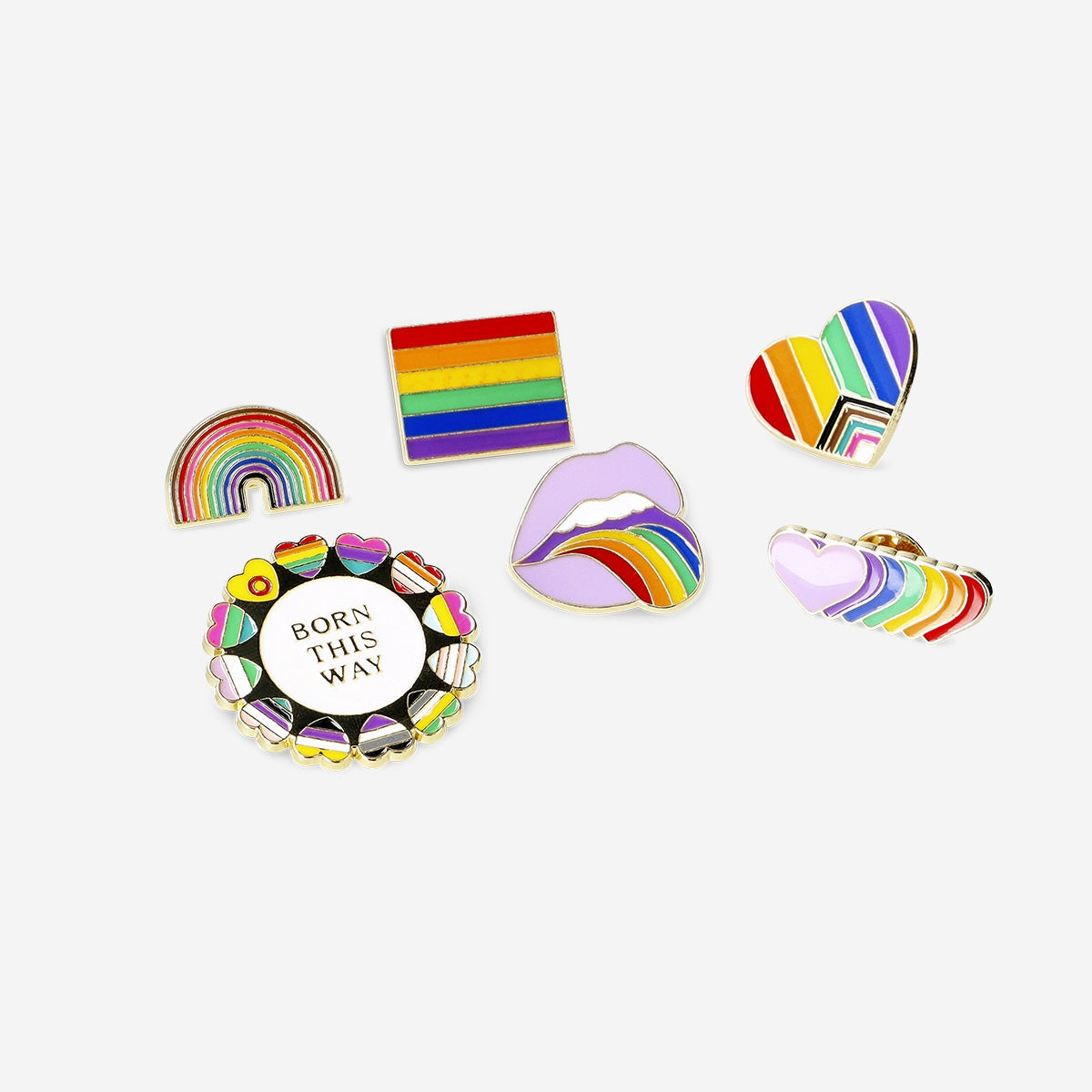 Set of six rainbow motif textile brooch pins by Flying Tiger Copenhagen, featuring colorful metal designs.