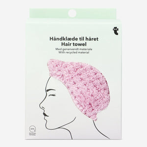 Pink plush hair towel from Flying Tiger Copenhagen with twist-and-button design for easy hair drying and personal care.