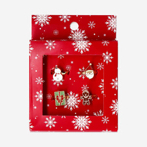 Set of four Christmas-themed adjustable textile rings by Flying Tiger Copenhagen, featuring festive holiday designs.