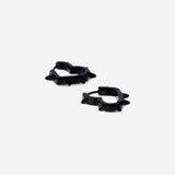 Black textile earrings with heart-shaped design from Flying Tiger Copenhagen, featuring a soft fabric texture and bold black color.
