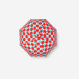 Folding umbrella by Flying Tiger Copenhagen with apple-themed textile design, compact and portable for rainy days.