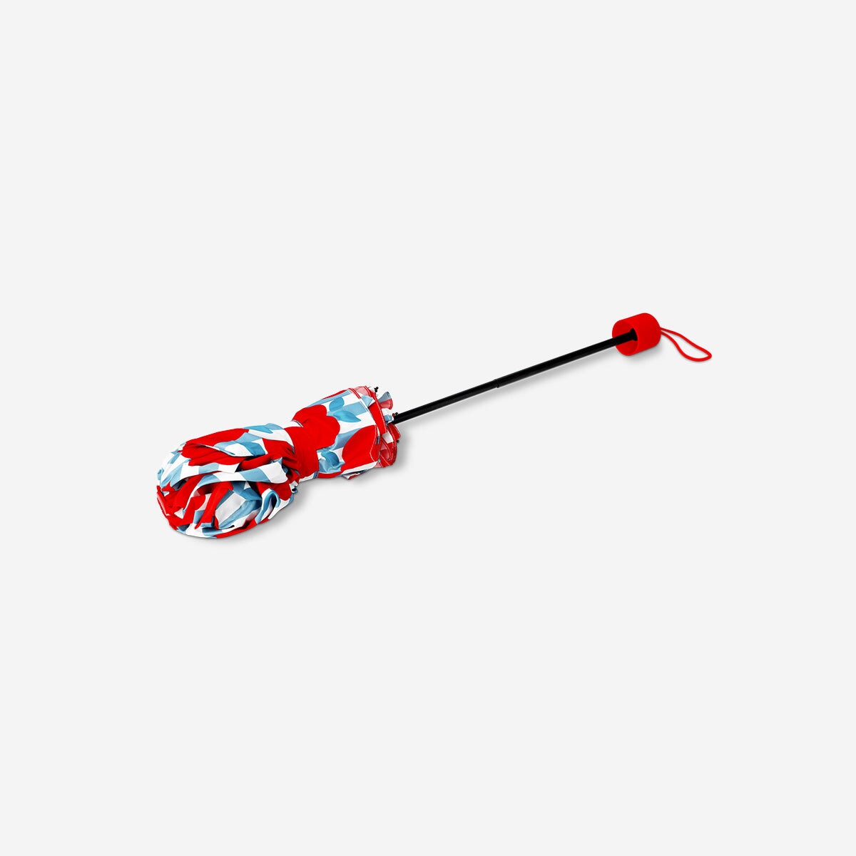 Folding textile umbrella with apple design by Flying Tiger Copenhagen, featuring colorful apple illustrations on the canopy.