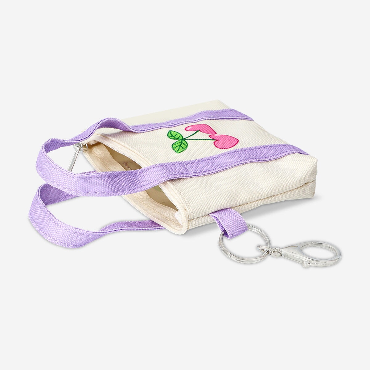 Flying Tiger Copenhagen textile key ring featuring a mini bag design, with colorful fabric details and a metal keyring attachment.