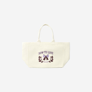 Textile shopper bag with a bow from Flying Tiger Copenhagen, featuring a stylish and functional design.