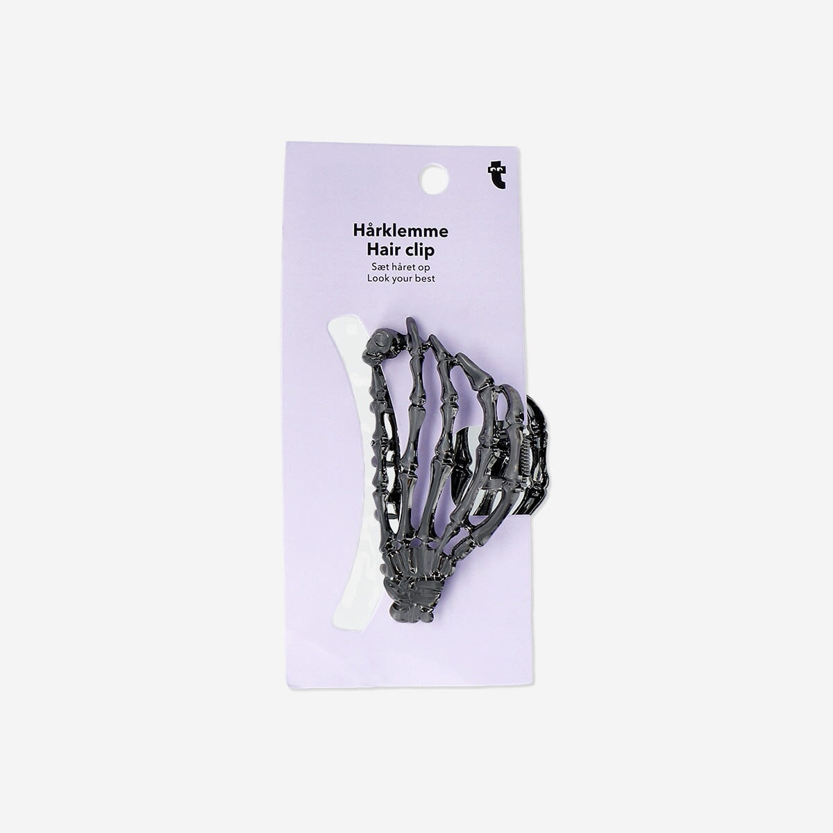 Skeleton-shaped textile hair clip from Flying Tiger Copenhagen featuring a black and white skeleton design.
