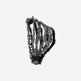 Textile skeleton hair clip from Flying Tiger Copenhagen with a detailed skeleton design and colorful fabric accents.