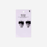 Textile skeleton hands earrings from Flying Tiger Copenhagen featuring detailed, spooky hand-shaped designs.